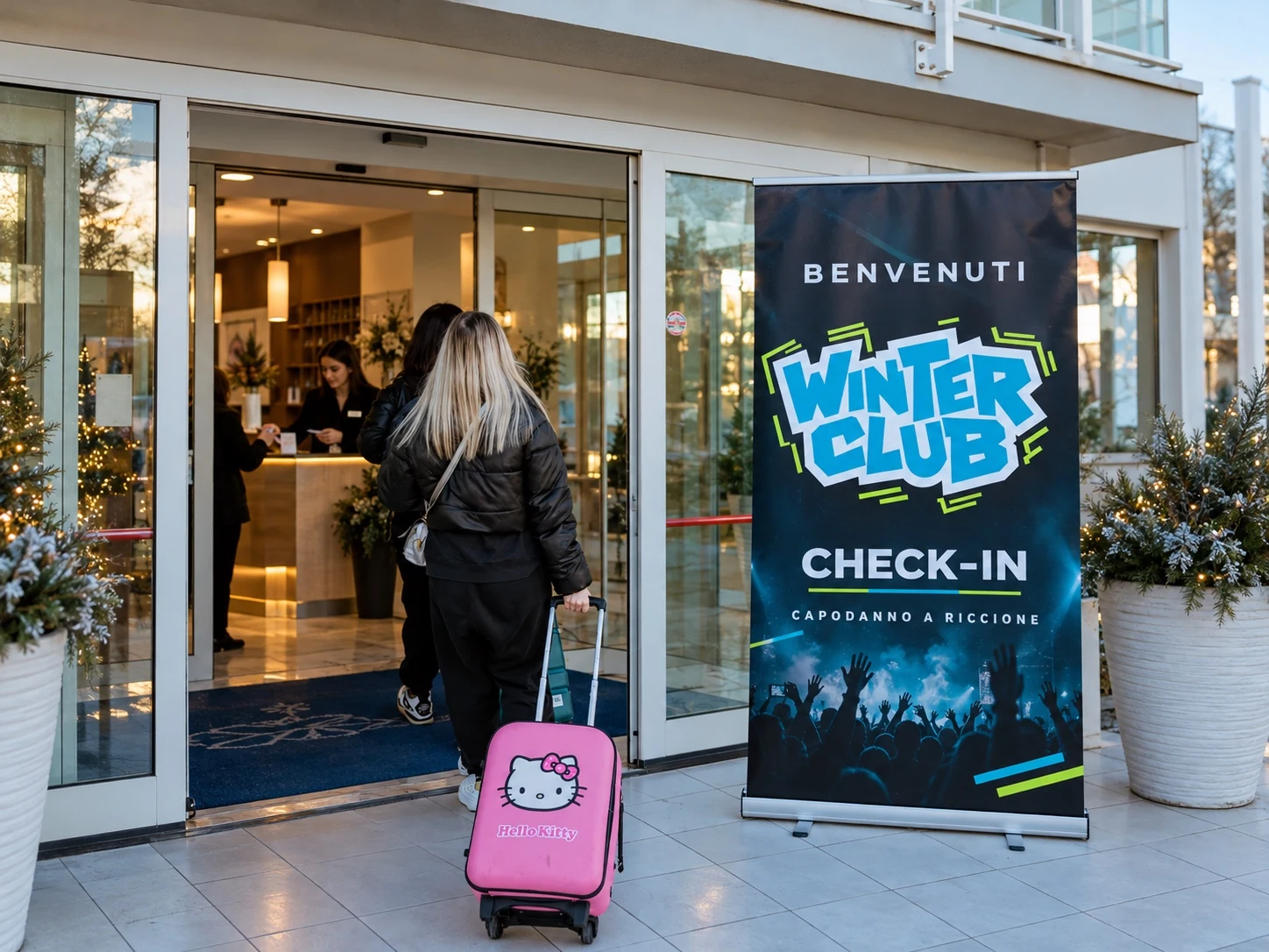 Ingresso di un hotel con insegna check-in WINTER CLUB